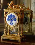 Astronomical clock; by Philippe-Jacques Corniquet; c.1794; gilt bronze and enamel face; unknown dimensions; Musée des Arts Décoratifs (Paris)
