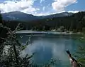Caumasee in the Flims Forest in front, Crap Sogn Gion left and Vorab, the white mountain to its right. The white Triangel is Crap Ner and Ofen the white peak to its right (TektonikArena Sardona)