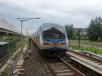 Most Beijing Subway rolling stock, such as this DKZ5 Line 13 train, run on 1,435 millimetres (56.5&nbsp;in) standard gauge track, drawing 750V direct current (DC) electrical power from the third rail.  Line 13, like most lines, use six-car Type-B train sets.