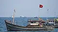 A civilian fishing boat flying the Vietnamese flag.