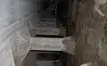 It is two meters between the new concrete plate and the original upstream face in granite. The concrete plate built 1929-31 is supported by 1700 horizontal beams.