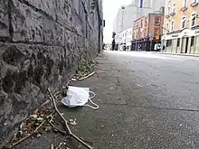 A&nbsp;discarded facemask on a Dublin street in June 2022.