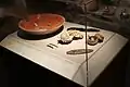 Red Dish and Jade Pendants; Shell and Jade Pendant; Stone Eccentrics and Bloodletters; Small Bowls and Jade Bead