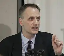 Dr. Horton speaking at a podium