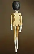 Peg wooden doll from Val Gardena, late 19th century, rear view