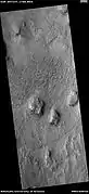 Wide view of ridges that are mostly curved.  Picture taken with HiRISE under HiWish program