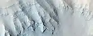 Close view of layers in Louros Valles, as seen by HiRISE under HiWish program Note this is an enlargement of a previous image.