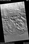 Wide view of surface with spots displaying mantle, as seen by HiRISE under HiWish program