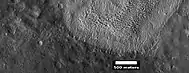 Contact between lower light-toned unit and an upper dark unit,  as seen by HiRISE under HiWish program