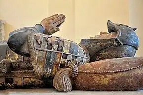 Detail of the Tomb of Philippe Pot (d. 1493) wearing amour and a heraldry shield.