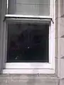 The Coat of arms of Haiti embossed on the old embassy's window
