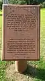 The plaque outside the complex