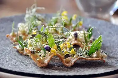 Toast with turbot roe, herbs and vinegar dust.