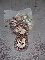 The foot imprint at Big foot museum is often adorned with money.