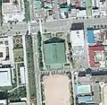 Aerial view of former Akita Municipal Gymnasium in 1975 (.mw-parser-output .geo-default,.mw-parser-output .geo-dms,.mw-parser-output .geo-dec{display:inline}.mw-parser-output .geo-nondefault,.mw-parser-output .geo-multi-punct{display:none}.mw-parser-output .longitude,.mw-parser-output .latitude{white-space:nowrap}39°43′7.9″N 140°06′17.1″E﻿ / ﻿39.718861°N 140.104750°E﻿ / 39.718861; 140.104750)