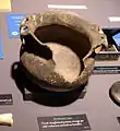 A storage pot with an unknown animal as effigy handles