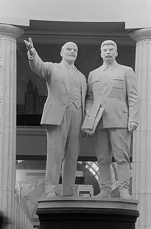 Two statues of people.