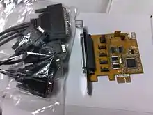 A four-port serial (RS-232) PCI Express&nbsp;×1 expansion card with an octopus cable that breaks the card's DC-37 connector into four standard DE-9 connectors