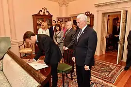 President Macron signs the State Department guestbook in the James Monroe Conference Room