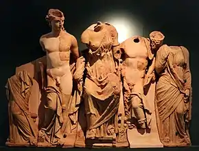 Remains of terracotta pediment group from Luna (paler areas reconstructed).