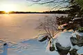 The sun rises above a frozen Lake Echo in 2007