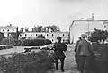 Gęsiówka after the liberation - in the picture, a Polish resistance fighter and two of the 348 liberated Jews (5 August 1944)