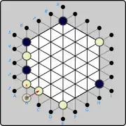 (3a) White introduces another piece on B1 again, but now is blocked from pushing to B2 .mw-parser-output .legend{page-break-inside:avoid;break-inside:avoid-column}.mw-parser-output .legend-color{display:inline-block;min-width:1.25em;height:1.25em;line-height:1.25;margin:1px 0;text-align:center;border:1px solid black;background-color:transparent;color:black}.mw-parser-output .legend-text{}&nbsp;(W)B1×B2&nbsp;, since that would push the Black piece at B5 out of play. The only legal push from B1 now is to C2 .mw-parser-output .legend{page-break-inside:avoid;break-inside:avoid-column}.mw-parser-output .legend-color{display:inline-block;min-width:1.25em;height:1.25em;line-height:1.25;margin:1px 0;text-align:center;border:1px solid black;background-color:transparent;color:black}.mw-parser-output .legend-text{}&nbsp;(W)B1→C2&nbsp; as shown by the solid arrow.