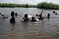Children swimming near Lamin Lodge.