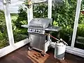 Gass grill with reusable LP gas cylinder