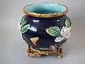 Flower pot, coloured lead glazes on biscuit, naturalistic in style.