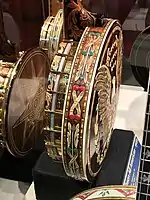 Decorated back and side of a Gibson All American banjo (1969).  Highly decorated with carvings, engravings and gold