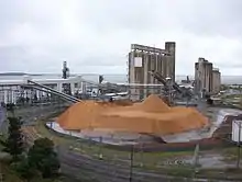 Image 53Storage Silos on the Gladstone waterfront, an industrial area in the water catchment area (from Environmental threats to the Great Barrier Reef)