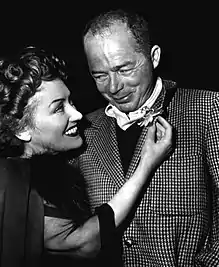 Black-and-white photograph of Gloria Swanson and Billy Wilder while filming Sunset Boulevard.
