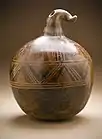 Gourd-shaped vessel; 850–1500; resist-painted ceramic; height: 26.35&nbsp;cm (10.mw-parser-output .frac{white-space:nowrap}.mw-parser-output .frac .num,.mw-parser-output .frac .den{font-size:80%;line-height:0;vertical-align:super}.mw-parser-output .frac .den{vertical-align:sub}.mw-parser-output .sr-only{border:0;clip:rect(0,0,0,0);clip-path:polygon(0px 0px,0px 0px,0px 0px);height:1px;margin:-1px;overflow:hidden;padding:0;position:absolute;width:1px}3⁄8in.), diameter: 20.32&nbsp;cm (8 in.); Los Angeles County Museum of Art