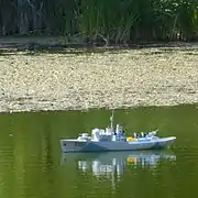 Model of HMCS&nbsp;Sackville in Griffin Pond