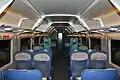 Pre-refurbishment: Two coat racks divide the part with tables from the rows of seats. The aisle to the right leads to four compartments