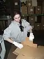 A guest helps out in the candy warehouse at the abbey.