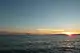 Sun setting over ocean waters