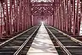 Image 10Hardinge Bridge is a steel railway bridge over the river Padma located at Paksey, Ishwardi, Pabna in western Bangladesh. It is named after Lord Hardinge, who was the Viceroy of India from 1910 to 1916. The bridge is 1.8 kilometres (1.1 mi) long.Photo Credit: Azim Khan Ronnie