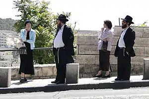 Typical Haredi dress for men and women
