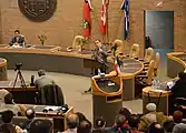Political activist Hassan Dai addressing in Toronto with the Imperial flag.