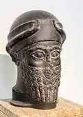 Assyrian head of a bearded god wearing a cap with horns dedicated by Puzur-Eshtar of Mari; middle Bronze Age; height: 37&nbsp;cm (15&nbsp;in); Vorderasiatisches Museumcode: deu promoted to code: de  (Berlin, Germany)