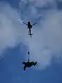 North Shore Rescue HFRS technician performing a flight evolution.