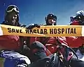 Former Gurkha officer Mike Trueman, who was born in Gosport, "protesting" on the summit of Everest, 13 May 1999.