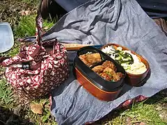 Two typical home made bento (one open, one wrapped); note the furoshiki cloths