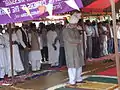 Khalifatul Massih V leading prayers on the pitch of the Jamia during his visit in 2004