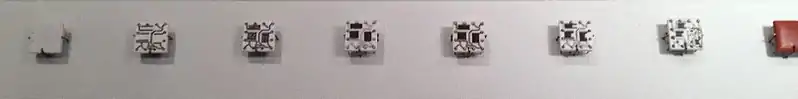 Steps in manufacturing Solid Logic Technology hybrid modules. The process starts with a blank ceramic wafer, .mw-parser-output .frac{white-space:nowrap}.mw-parser-output .frac .num,.mw-parser-output .frac .den{font-size:80%;line-height:0;vertical-align:super}.mw-parser-output .frac .den{vertical-align:sub}.mw-parser-output .sr-only{border:0;clip:rect(0,0,0,0);clip-path:polygon(0px 0px,0px 0px,0px 0px);height:1px;margin:-1px;overflow:hidden;padding:0;position:absolute;width:1px}1⁄2 inch (13 mm) square. Circuits are laid down first, followed by resistive material. Pins are added, the circuits are soldered and the resistors trimmed to the desired value. Then individual transistors and diodes are added and the package is encapsulated.
