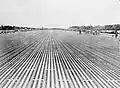 View of the main runway at RAF Changi, Singapore, soon after its completion. The runway constructed from 276,680 pierced steel sheets was 2,000 yards in length and 50 yards wide was able to take the largest aircraft then in service with the RAF.