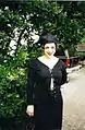 Image 68Woman dressed in black maxi skirt, top and hat, 1995. (from 1990s in fashion)