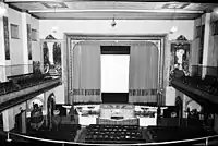 Interior of the auditorium, proscenium arch, horseshoe mezzanine, wall murals and Wurlitzer organ